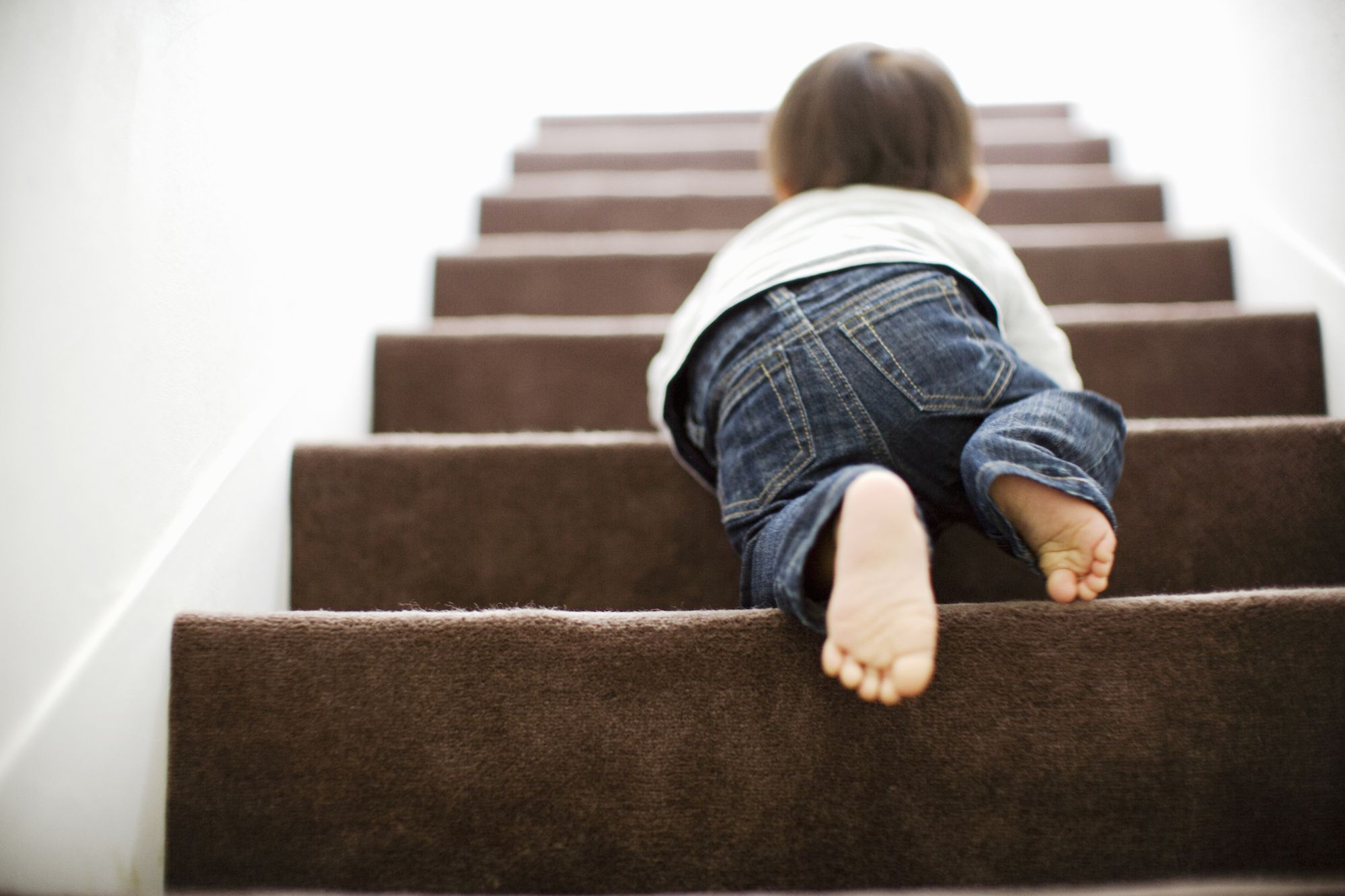 A child climbing steps one at a time